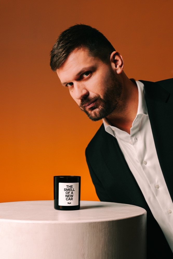 A bespoke Rahu candle made for Bolt, labelled 'The Smell of a New Car'